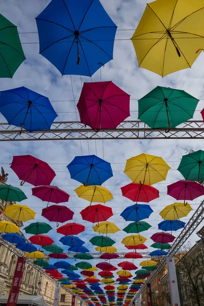 Street decoration, lots of colorful umbrellas in the air — Stock Photo, Image