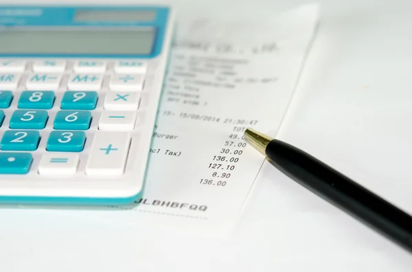 Receipt paper and calculator — Stock Photo, Image