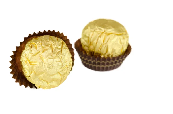 Chocolate wrapped in gold — Stock Photo, Image
