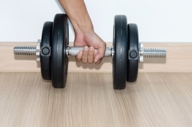 elini tutmak Dumbbell