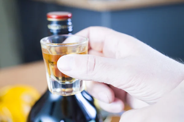 Alcohol shot glass on a table — Stock Photo, Image