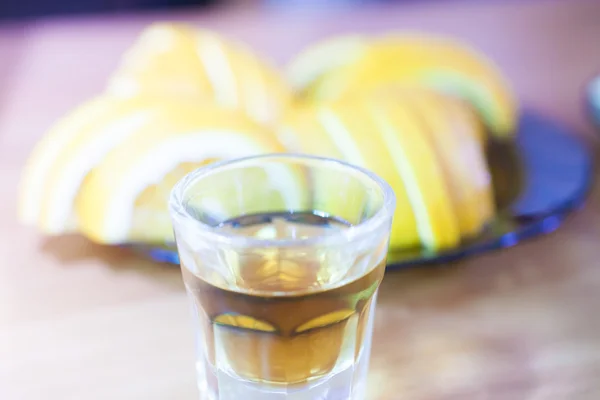 Alcohol shot glass on a table — Stock Photo, Image