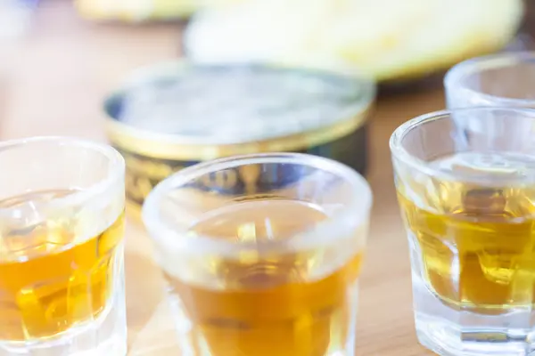 Alcohol shot glass on a table — Stock Photo, Image