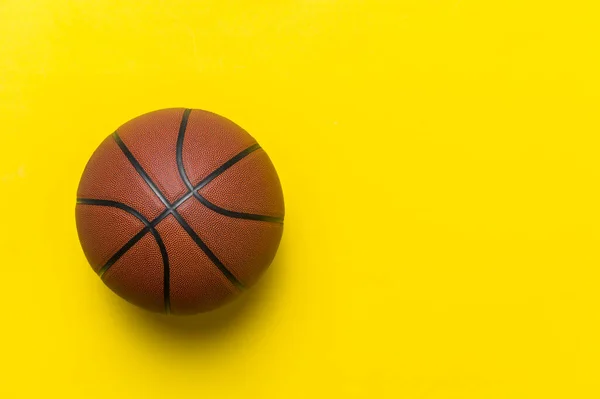 Close Brown Basketball Ball Isolated Yellow Sport Team Concept Top — Zdjęcie stockowe