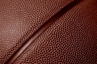 Basketbol topu dokusunun yakın plan detayları. Kırmızı renk filtresi. Banner sanat konsepti. Takım sporu