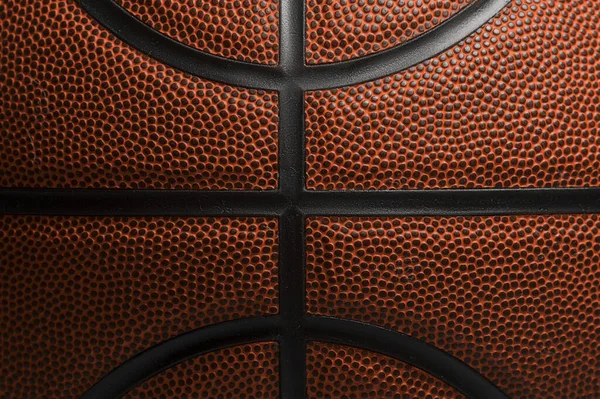Closeup detail of basketball ball texture background. Team sport concept. Sports background for product display, banner, or mocku