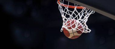 Turuncu basketbol topu sepetin içinden uçar. Profesyonel spor anlayışı.