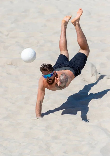 Professional beach volleyball player in action, receiving the ball. Vertical sport poster, greeting cards, headers, website