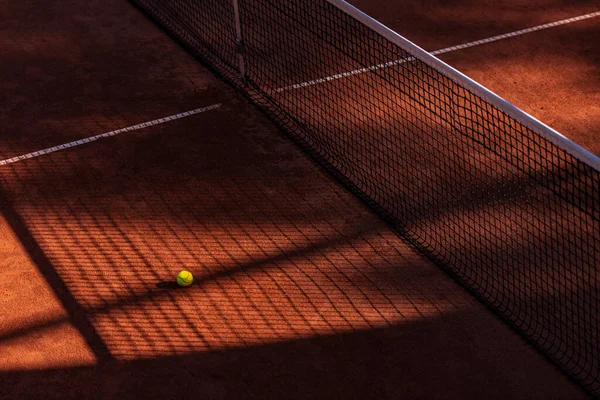 Orange tennis court net  and ball with shadows. Horizontal sport poster, greeting cards, headers, website