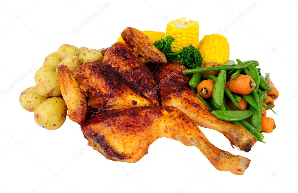 Roasted spatchcock chicken with piri piri seasoning and mixed vegetables isolated on a white background