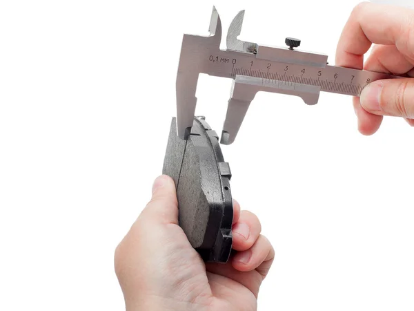 Brake pads with caliper on engineer hand. — Stock Photo, Image