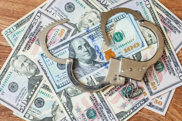 Долари і наручники . — стокове фото