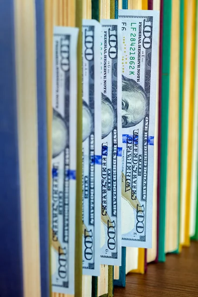 Hundred dollars lie between pages. — Stock Photo, Image