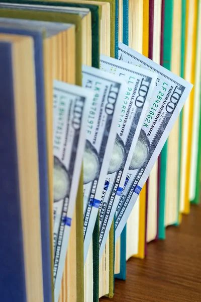 Hundred dollars lie between pages. — Stock Photo, Image