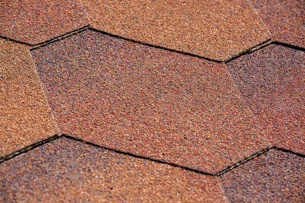 bituminous shingles waterproof protective roof covering close-up view.