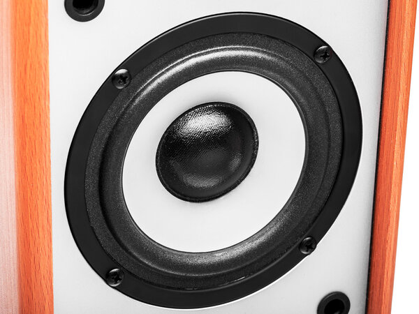 Acoustic column of gray color with finishing under a tree on a white background, the white loudspeaker with a black subweight and a black dome. The isolated image, nobody.