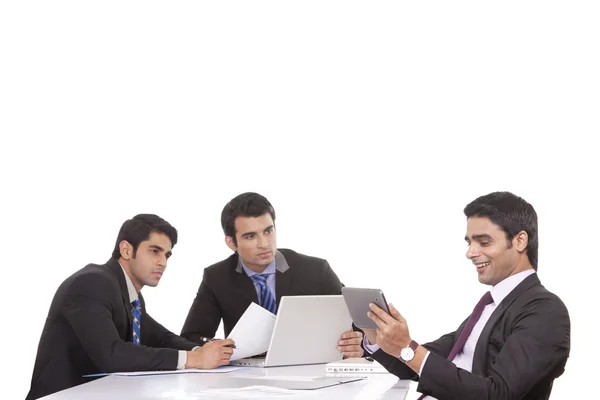 Businessman messaging as colleagues watch on — Stock Photo, Image