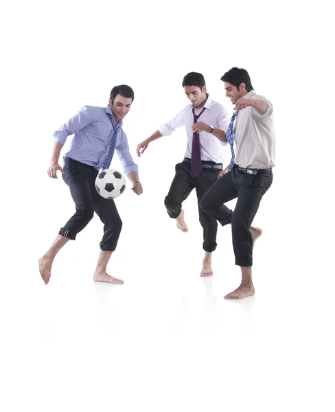 Male executives playing soccer — Stock Photo, Image