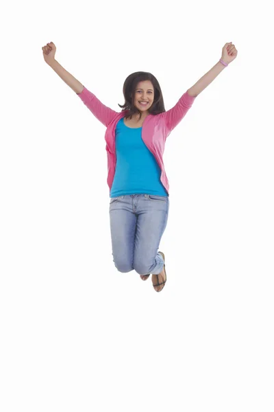 Woman jumping in mid-air — Stock Photo, Image