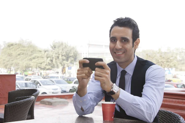 Businessman with a mobile phone — Stock Photo, Image