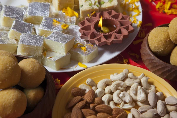 Sweets and nuts on table — Stock Photo, Image