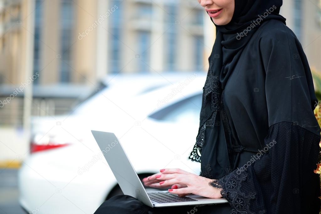 Emarati Arab Business woman using laptop