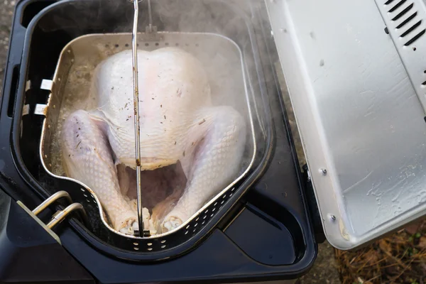 Turkey Sizzling in Deep Fryer Stock Photo