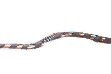 Large wide cable with multicolored orange and green wires, connectors and terminals in the wiring repair shop and electricians for connecting and transmitting electricity and digital signal in the car clipart