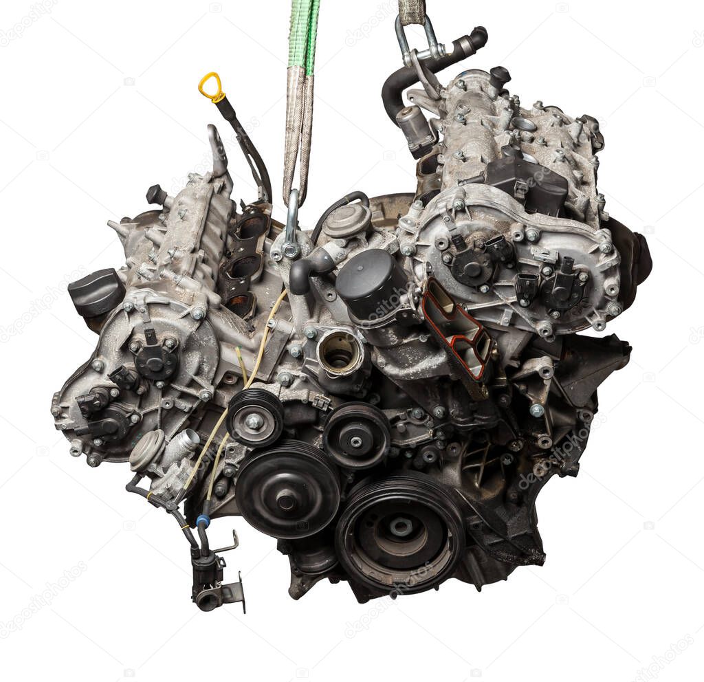 Close Up of V6 engine for the maintenance and repair of a car in a auto service on white isolated background. Vehicle parts catalog.