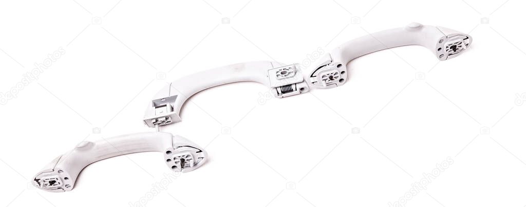 Vehicle interior grab handles of ceiling on white isolated background. Auto service industry. Spare parts catalog of junkyard.