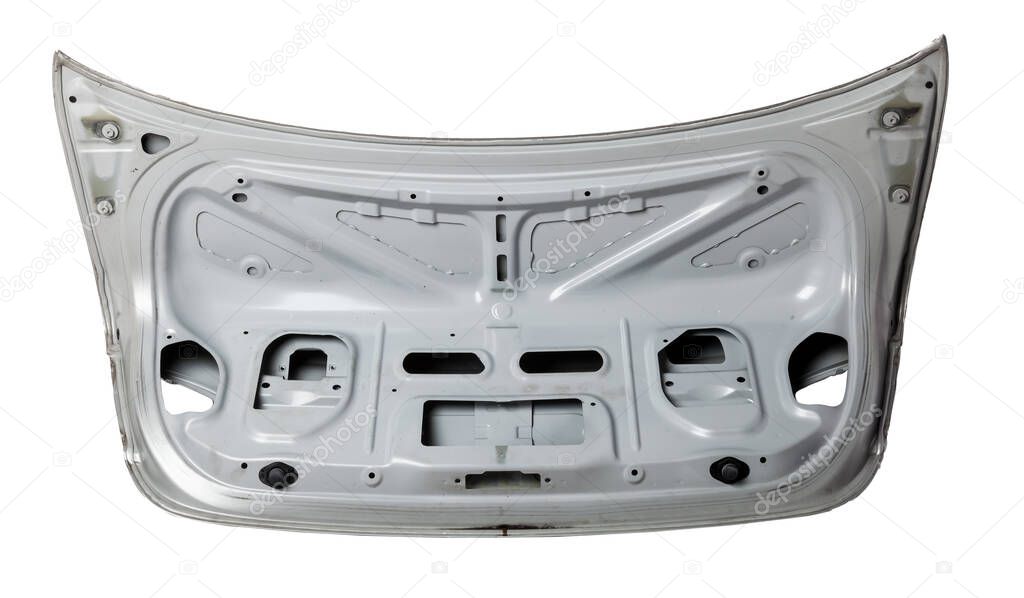 Silver metallic boot lid reverse side with stiffeners on a white isolated background in a photo studio with a nameplate for installation on a car after an accident. Spare part for body repair.