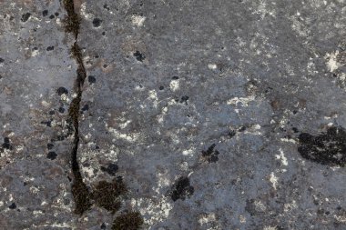 Tasarım ve jeoloji için farklı desenlere sahip antik bir kayanın arka planı ve dokusu.