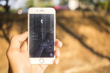 CHIANG MAI, THAILAND - JANUARY 04, 2015: Tumblr micro-blogging service that allows users to post text messages on Apple iphone 6, images, videos, links, quotes and audio to their tumblelog.