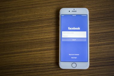CHIANG MAI, THAILAND - JANUARY 02, 2015: Facebook Login page application using Apple iPhone 6. Facebook is largest and most popular social networking site in the world.