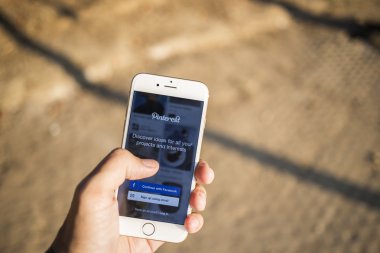 CHIANG MAI, THAILAND - JANUARY 04, 2015: Close-up shot of brand new Apple iphone 6,  with Pinterest application login on a screen.