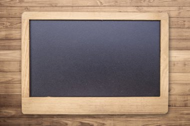 Chalk board on Brown wood plank wall texture background