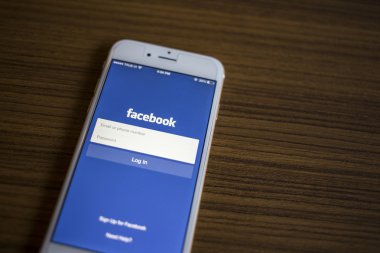 CHIANG MAI, THAILAND - JANUARY 02, 2015: Facebook Login page application using Apple iPhone 6. Facebook is largest and most popular social networking site in the world.