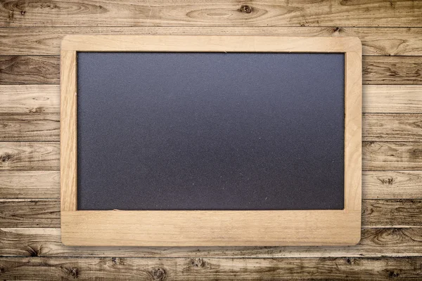 Chalk board on Brown wood plank wall texture background — Stockfoto