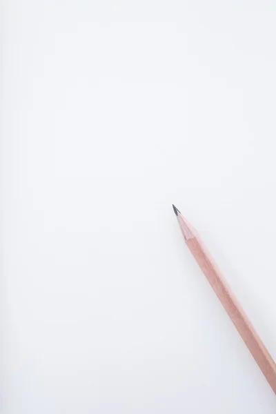 Wood pencil on blank paper — Zdjęcie stockowe