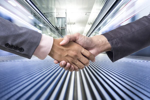 Business handshake on business movement background — Stock Photo, Image