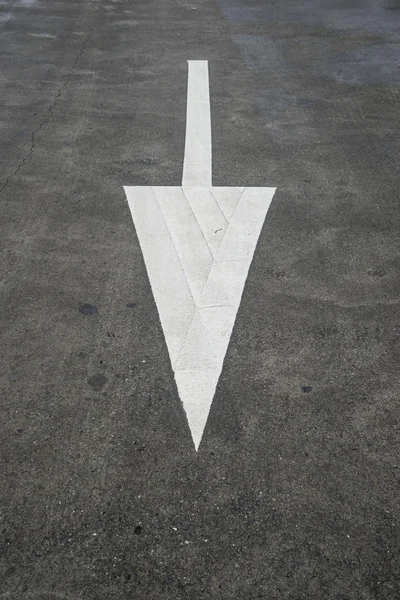 Arrow sign on texture road. — Stock Photo, Image