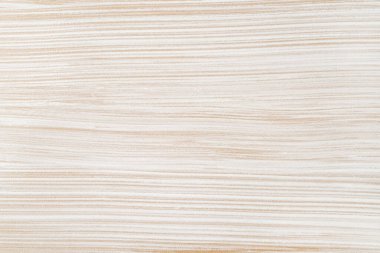 Açık kahverengi bir yüzey üzerinde düz olmayan beyaz rengin dalgalı dokusu. Arka plan makrofotoğrafçılığını boya. İnşaat işleri, resim işleri, tadilat ve dekorasyon için tasarım elementleri. Üst görünüm.