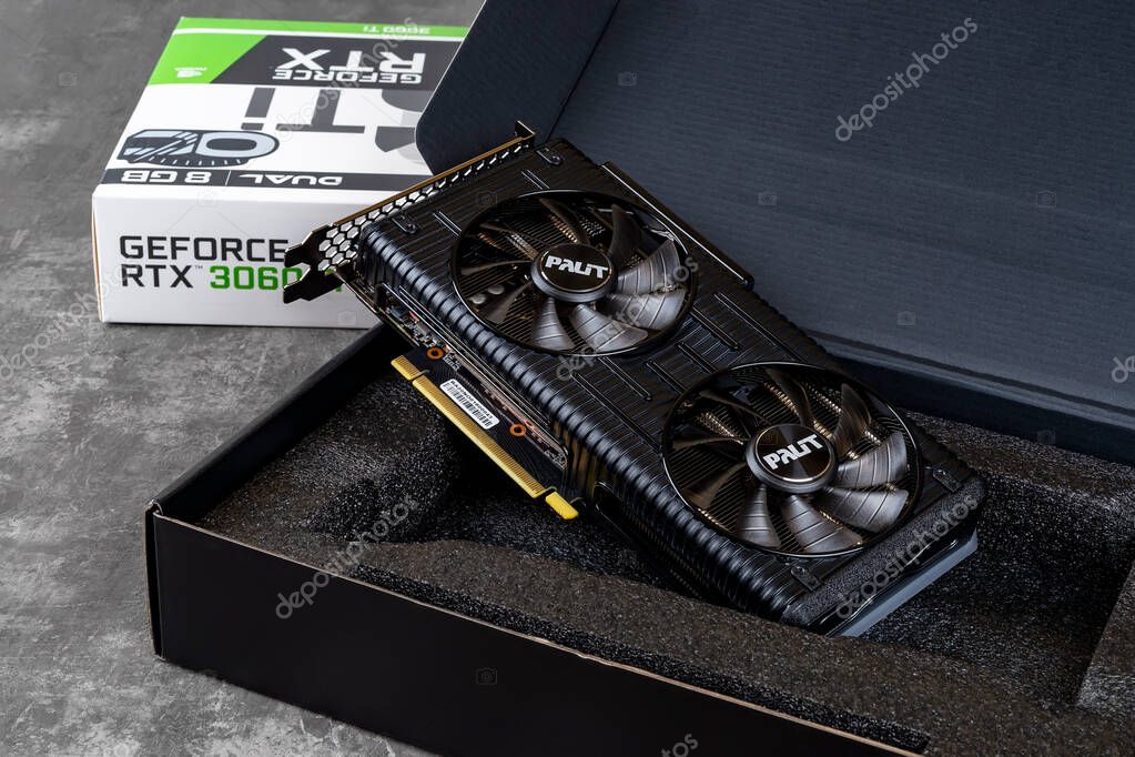 Varna, Bulgaria, January 11, 2021. Palit Nvidia Geforce RTX 3060 Ti Dual OC gaming graphics card in an open box against dark background. Modern desktop pc hardware components for build and upgrade.