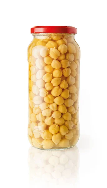 Canned chickpeas in a full glass jar with red lid isolated on a white background. Pre cooked tasty hummus ingredient. Ready to eat legume in a glass container. Vegetarian food design element. Front view.