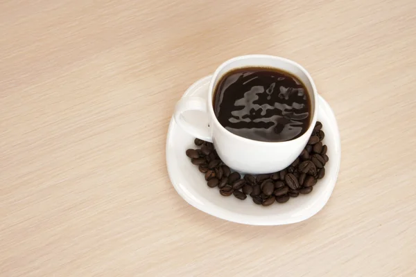 Taza de café sobre fondo de madera — Foto de Stock