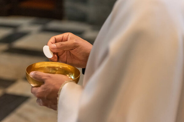 The elevation of the Sacramental Bread during the catholic liturgy