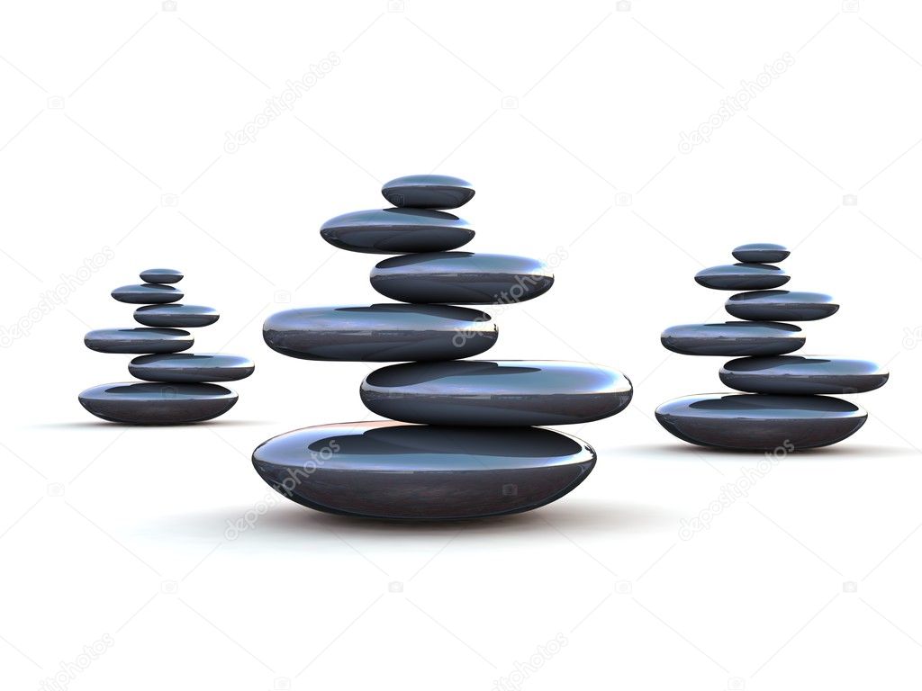 Pebbles stacked on each other on a white background