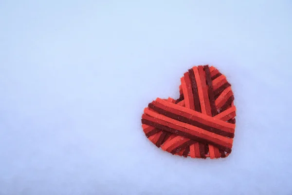 Crochet colorful heart on snow — Stock Photo, Image