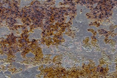 Eski paslı demir metal arka plan plakası dokusu.