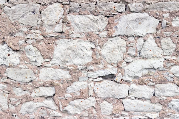 Bir taş duvarın parçası, arkaplan ya da doku için. — Stok fotoğraf